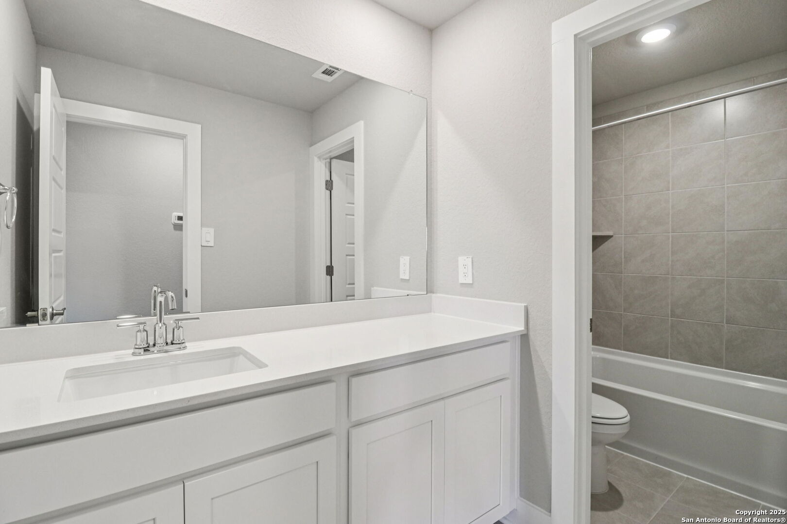 12602 Winding Butte Schertz, TX 78154 - Photo 32 of 46 a bathroom with a sink and a mirror