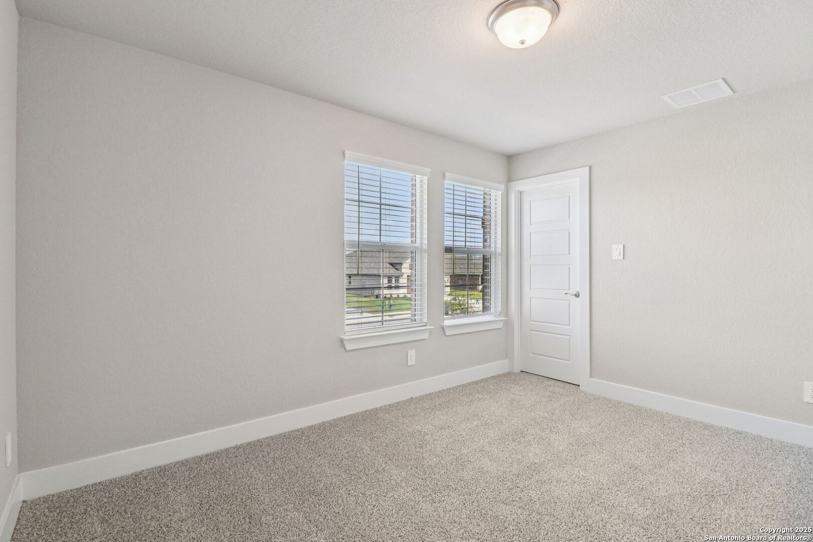 12602 Winding Butte Schertz, TX 78154 - Photo 33 of 46 an empty room with windows and closet