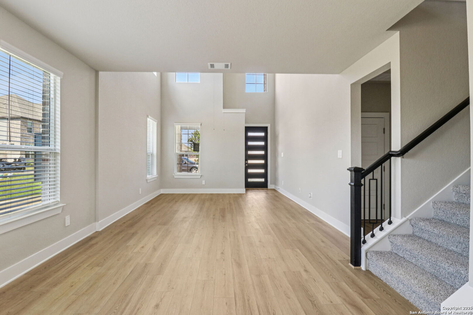 12602 Winding Butte Schertz, TX 78154 - Photo 6 of 46 wooden floor in an empty room with a window