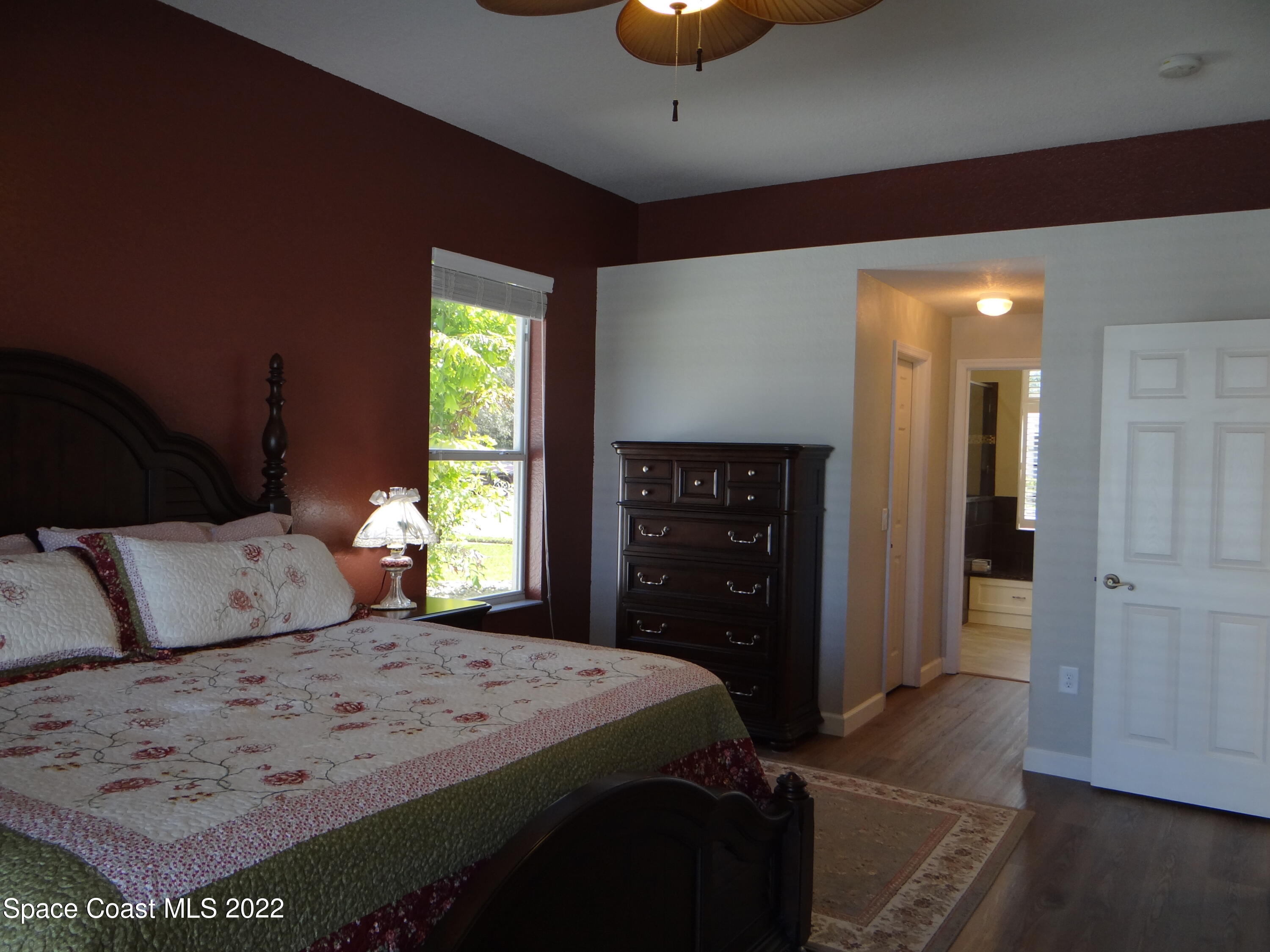 3100 Huntleigh Way Melbourne, FL 32934 - Photo 22 of 54 a bedroom with a bed and a window
