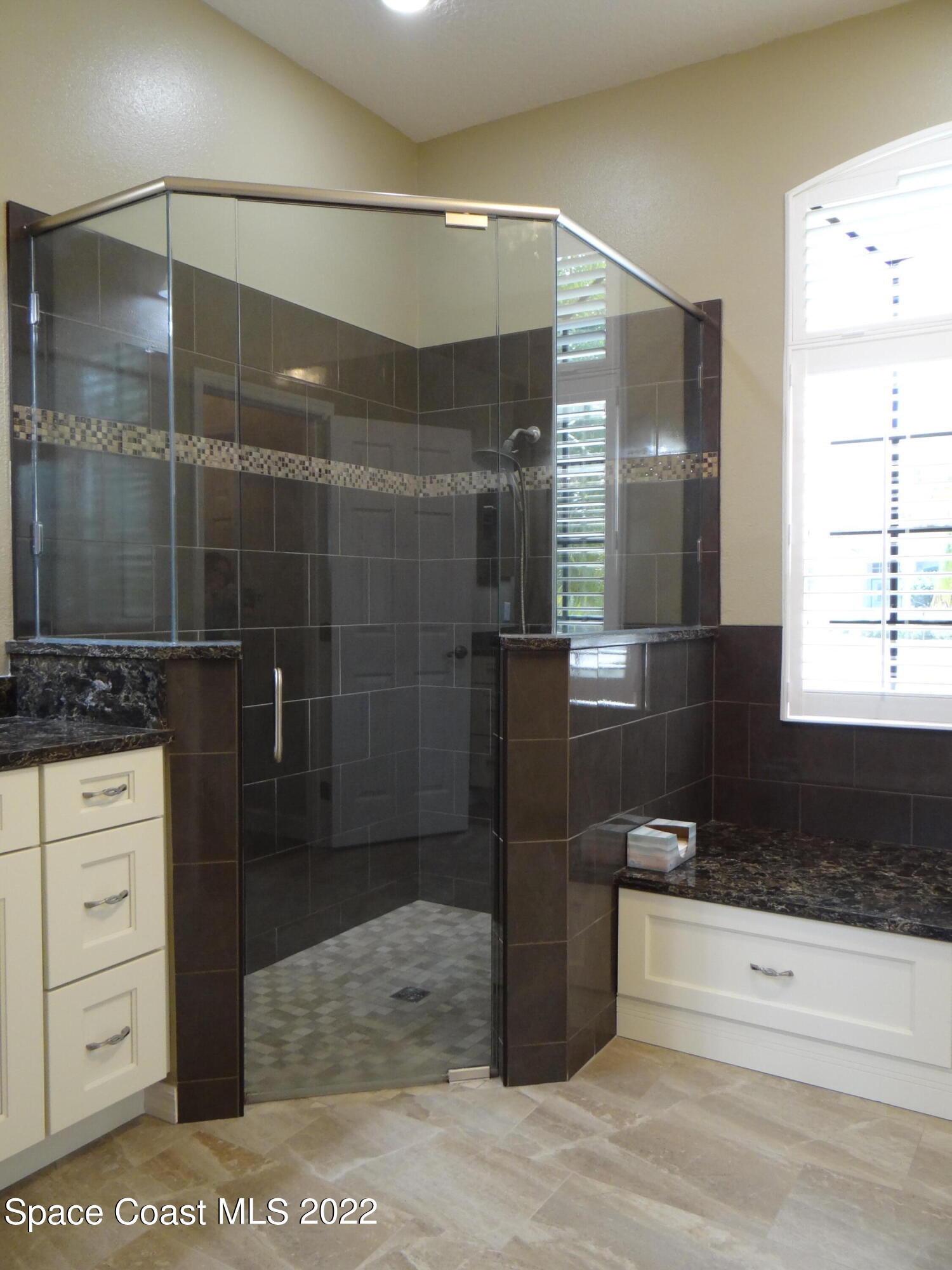 3100 Huntleigh Way Melbourne, FL 32934 - Photo 29 of 54 a bathroom with a shower and a sink