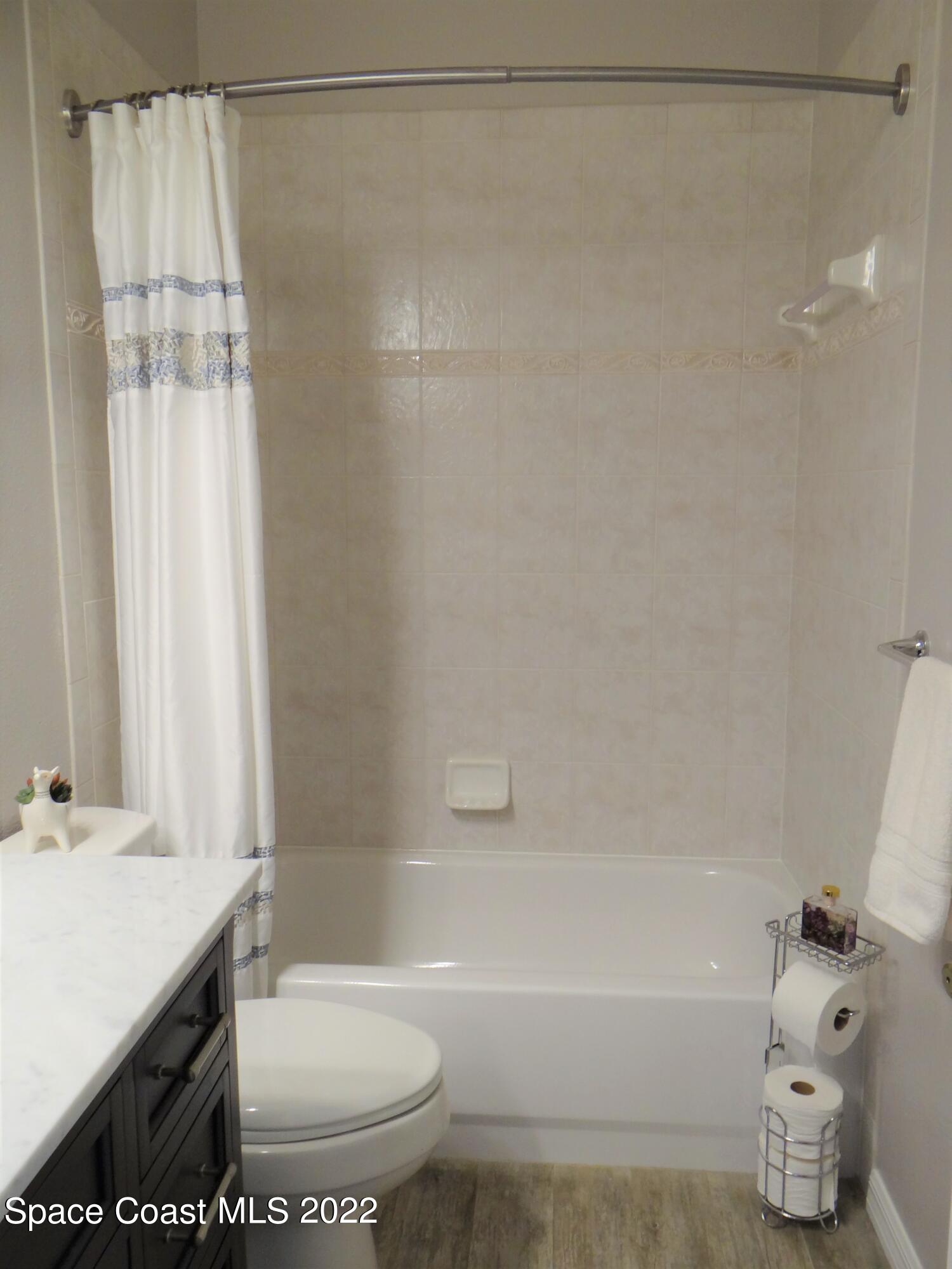 3100 Huntleigh Way Melbourne, FL 32934 - Photo 34 of 54 a bathroom with a sink toilet and shower