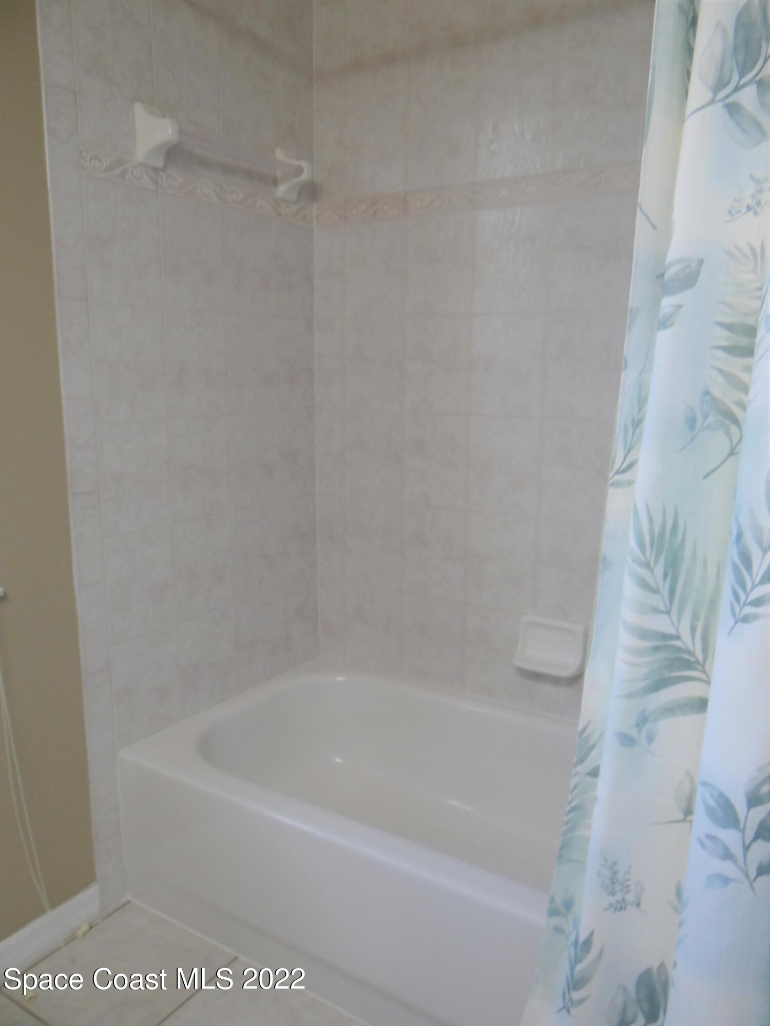 3100 Huntleigh Way Melbourne, FL 32934 - Photo 39 of 54 a close up of a bathtub curtain