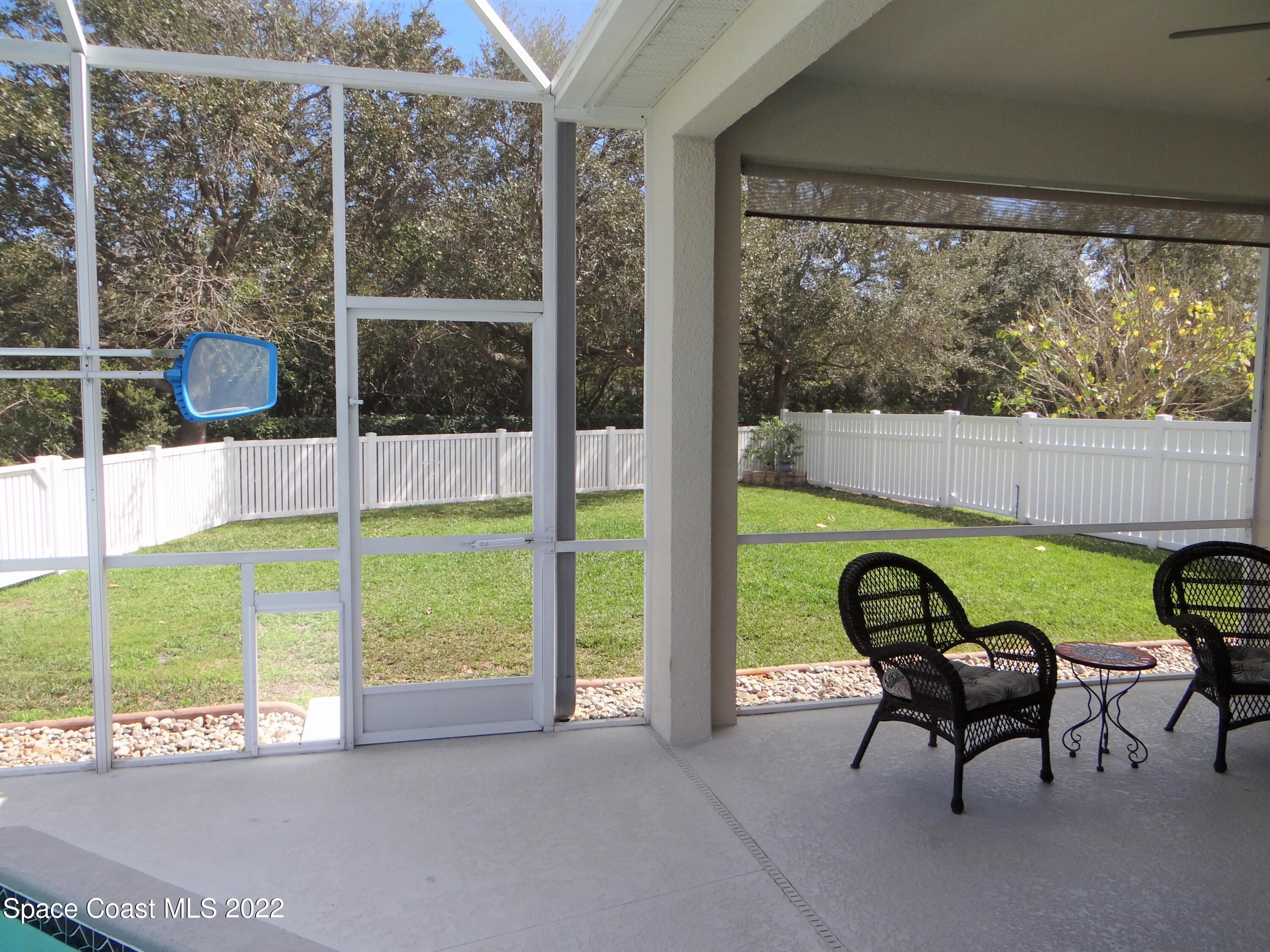 3100 Huntleigh Way Melbourne, FL 32934 - Photo 43 of 54 a view of a two chairs and table in patio