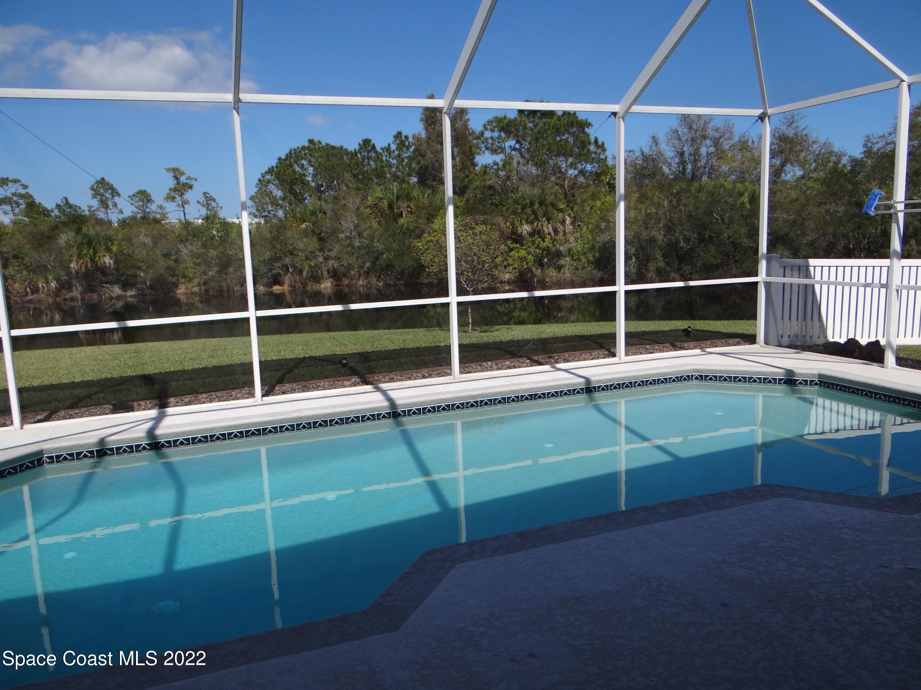 3100 Huntleigh Way Melbourne, FL 32934 - Photo 45 of 54 a view of a deck with a chair and table