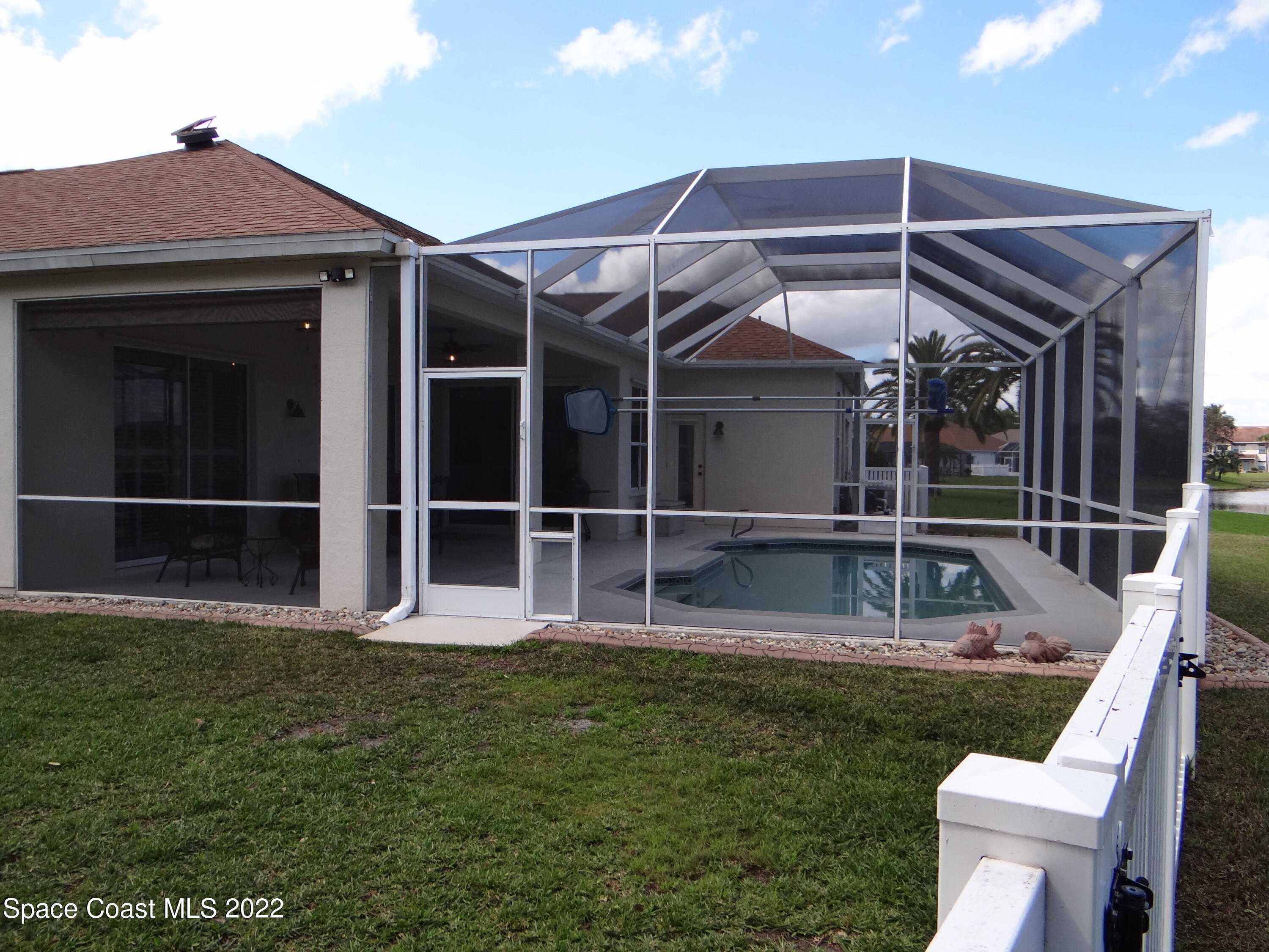 3100 Huntleigh Way Melbourne, FL 32934 - Photo 49 of 54 a view of an house with backyard space and balcony
