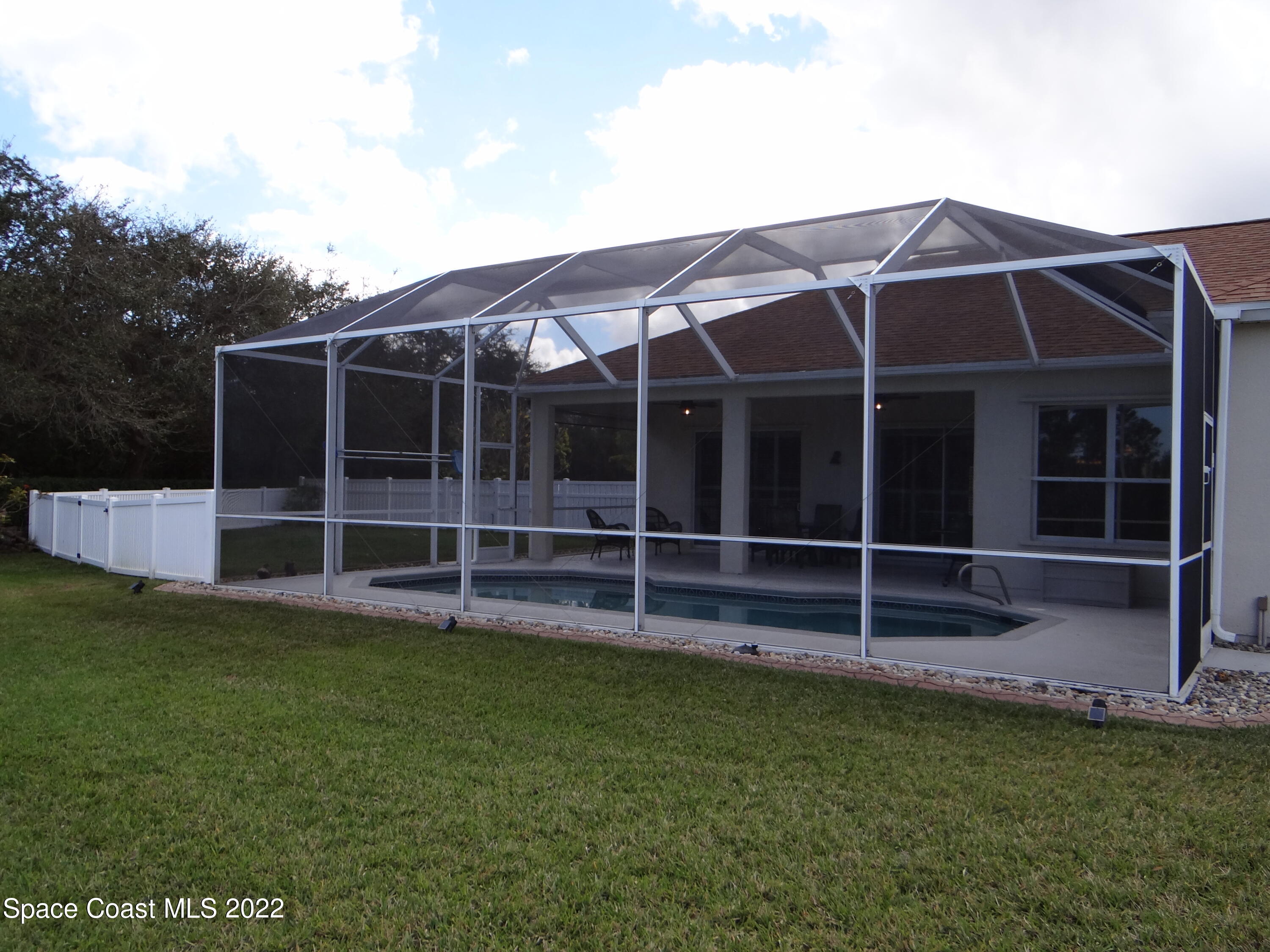 3100 Huntleigh Way Melbourne, FL 32934 - Photo 50 of 54 a view of a house with a yard and sitting area