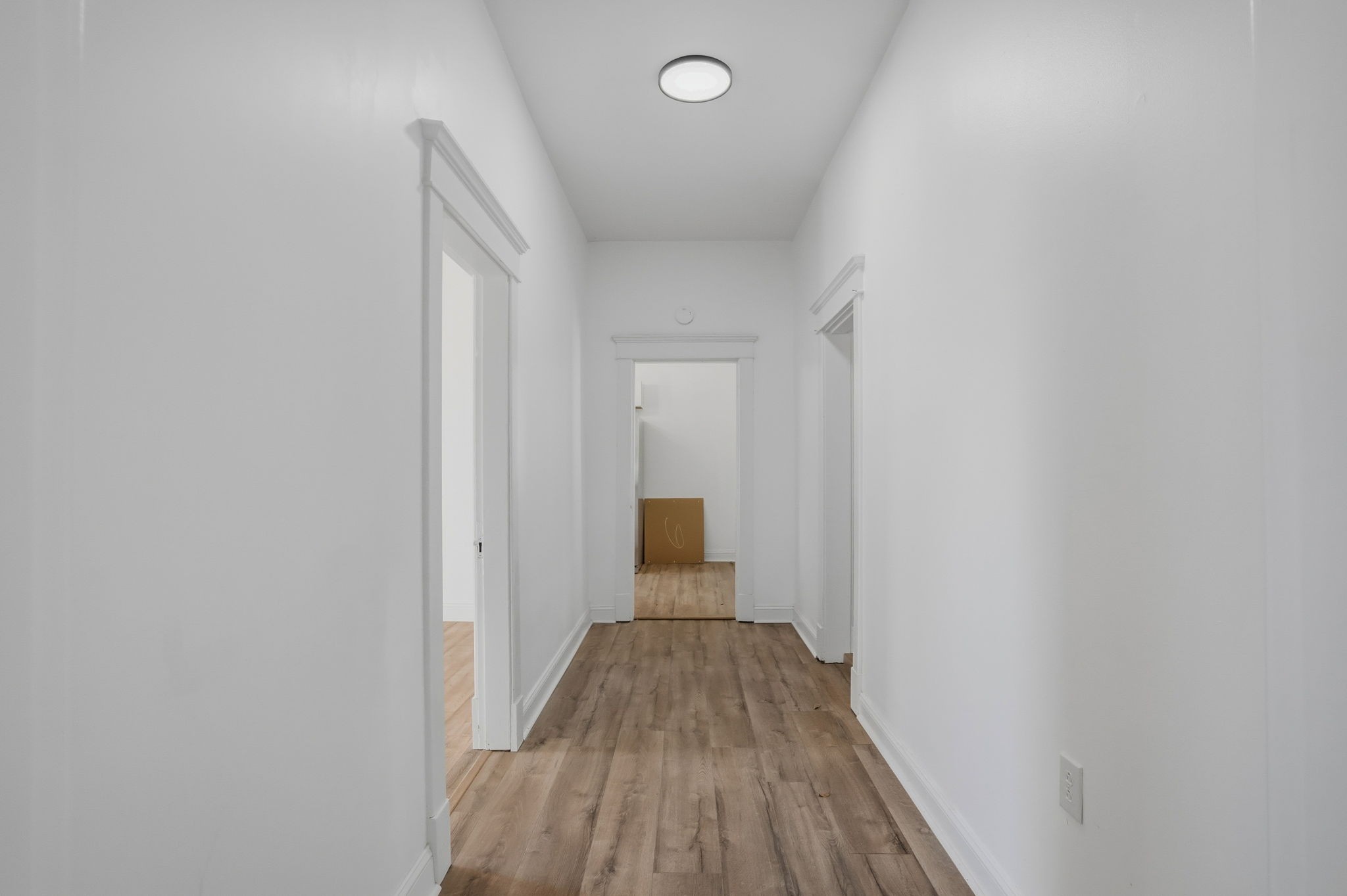 204 Winters Street Adams, TN 37010 - Photo 9 of 18 a view of a hallway with wooden floor