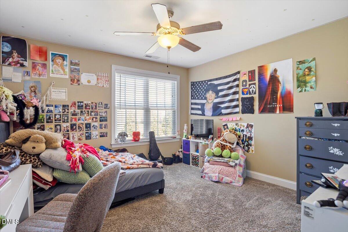 1001 Bellewood Farms Road Raleigh, NC 27603 - Photo 37 of 39 a bedroom with furniture and a large window