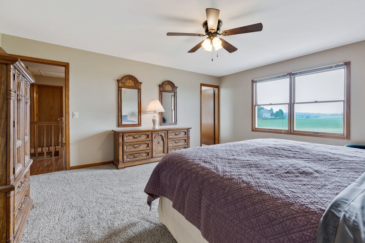 753 Millview Drive Batavia, IL 60510 - Photo 15 of 30 a bedroom with a bed and a large mirror on the dresser