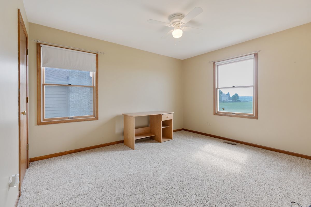 753 Millview Drive Batavia, IL 60510 - Photo 22 of 30 an empty room with windows and ceiling fan