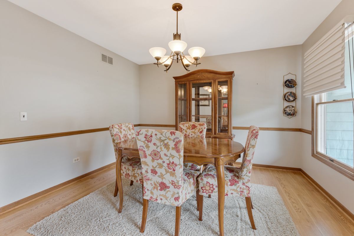 753 Millview Drive Batavia, IL 60510 - Photo 6 of 30 a view of a dining room with furniture and wooden floor