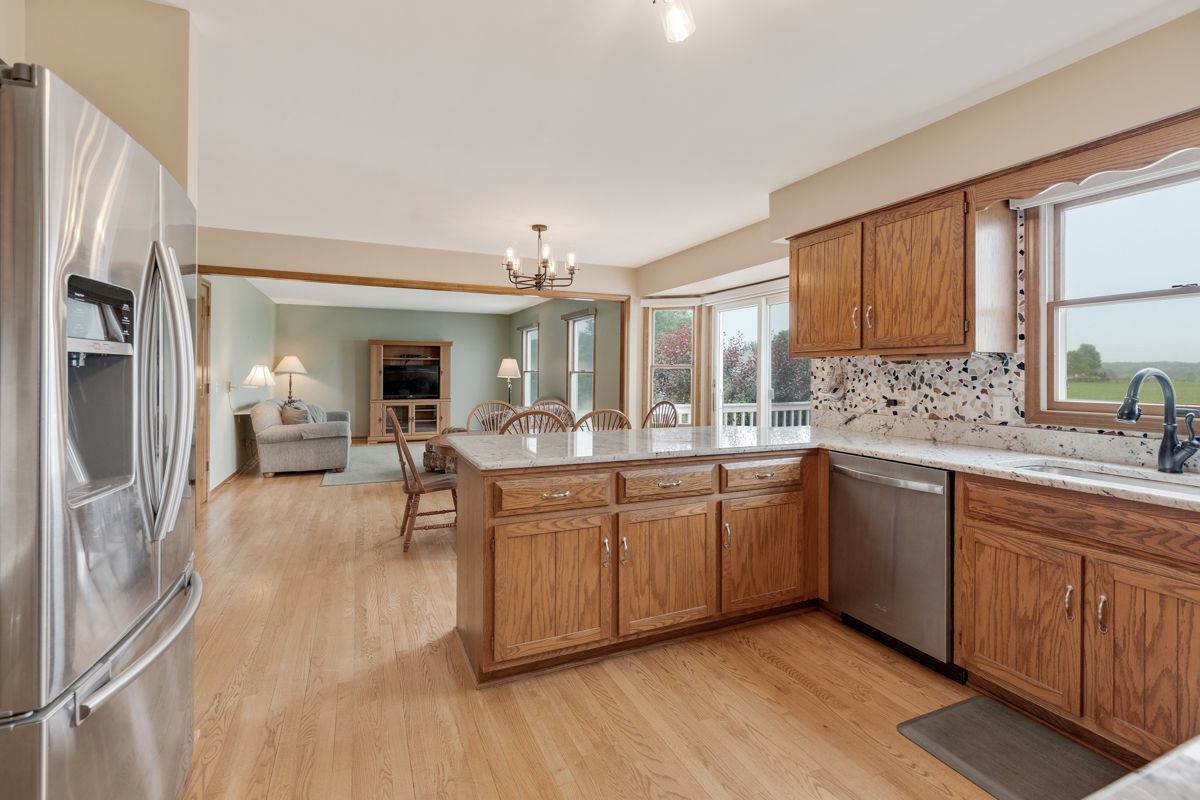 753 Millview Drive Batavia, IL 60510 - Photo 9 of 30 a large kitchen with a lot of counter space and a wooden floor