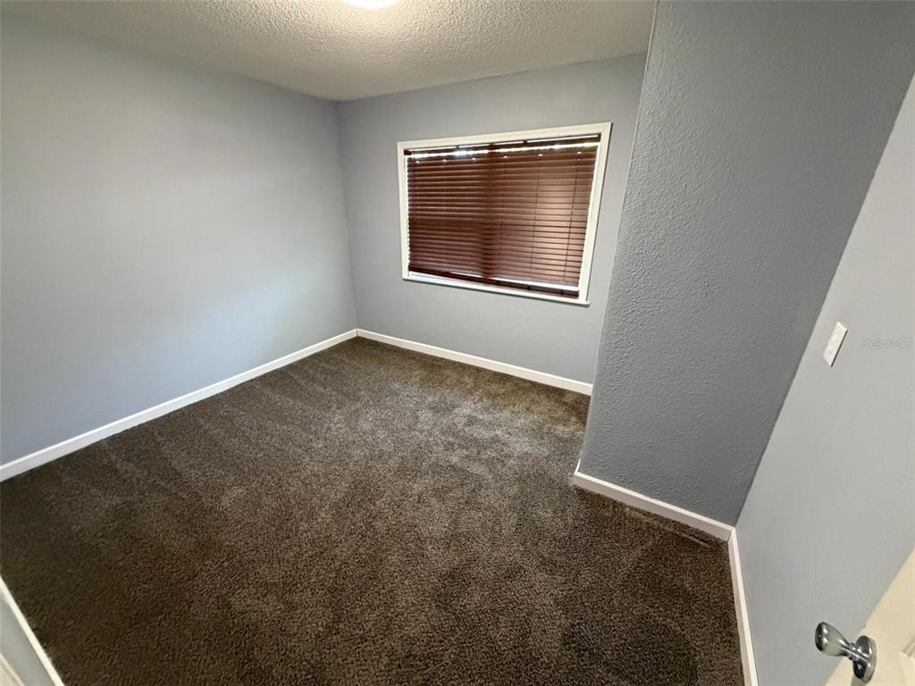 9816 East Granada Court Inverness, FL 34450 - Photo 13 of 28 an empty room with a window