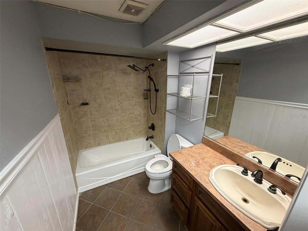 9816 East Granada Court Inverness, FL 34450 - Photo 20 of 28 a bathroom with a sink toilet and shower