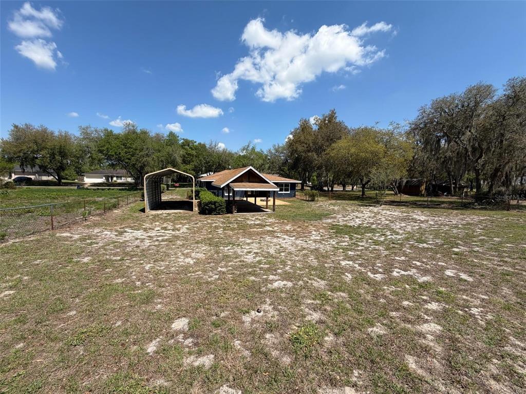 9816 East Granada Court Inverness, FL 34450 - Photo 8 of 28 a view of a house with a yard