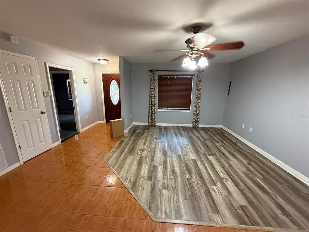 9816 East Granada Court Inverness, FL 34450 - Photo 10 of 28 a bedroom with a bed and a chandelier