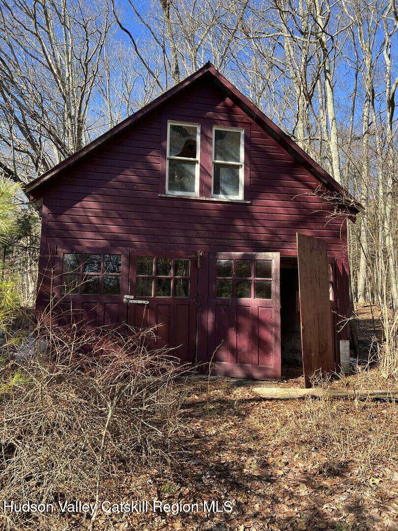 120-122 Mill Road Stone Ridge, NY 12484 - Photo 5 of 6 a front view of a house with garden