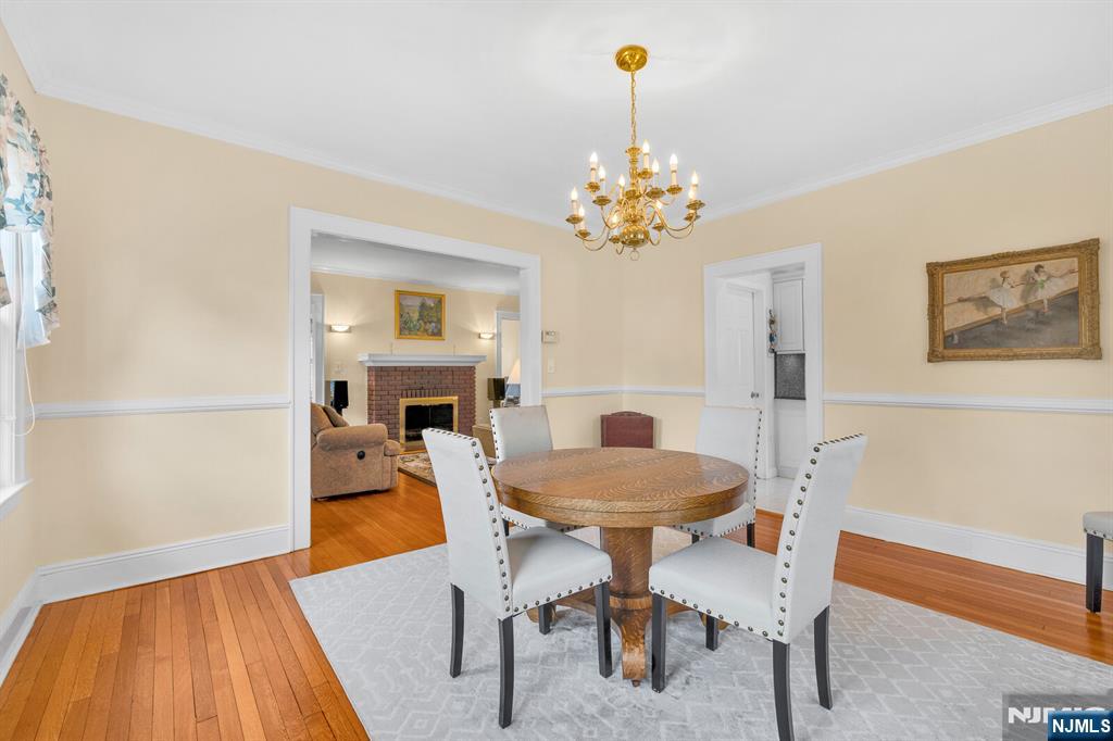 106 Maple Street Rutherford, NJ 07070 - Photo 16 of 50 a view of a dining room with furniture and a chandelier