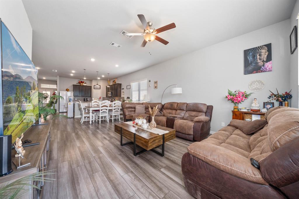 3409 Beutel Road Lorena, TX 76655 - Photo 12 of 32 a living room with furniture kitchen view and a potted plant