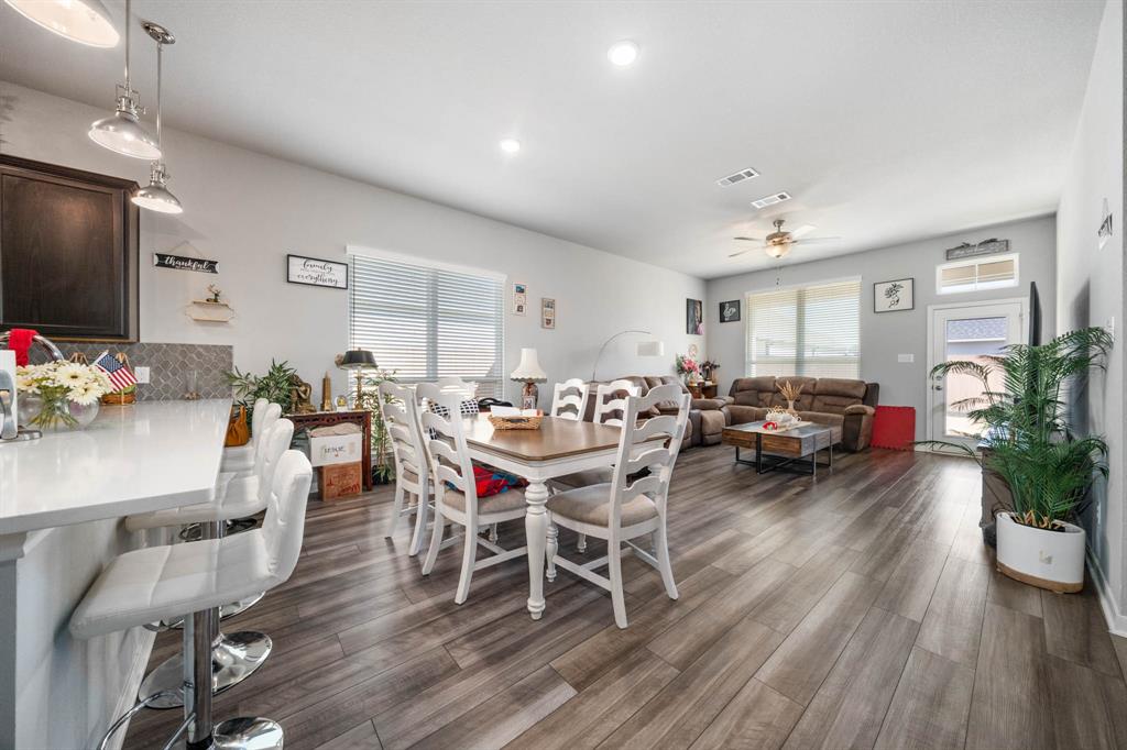 3409 Beutel Road Lorena, TX 76655 - Photo 13 of 32 a living room with furniture dining room and wooden floor