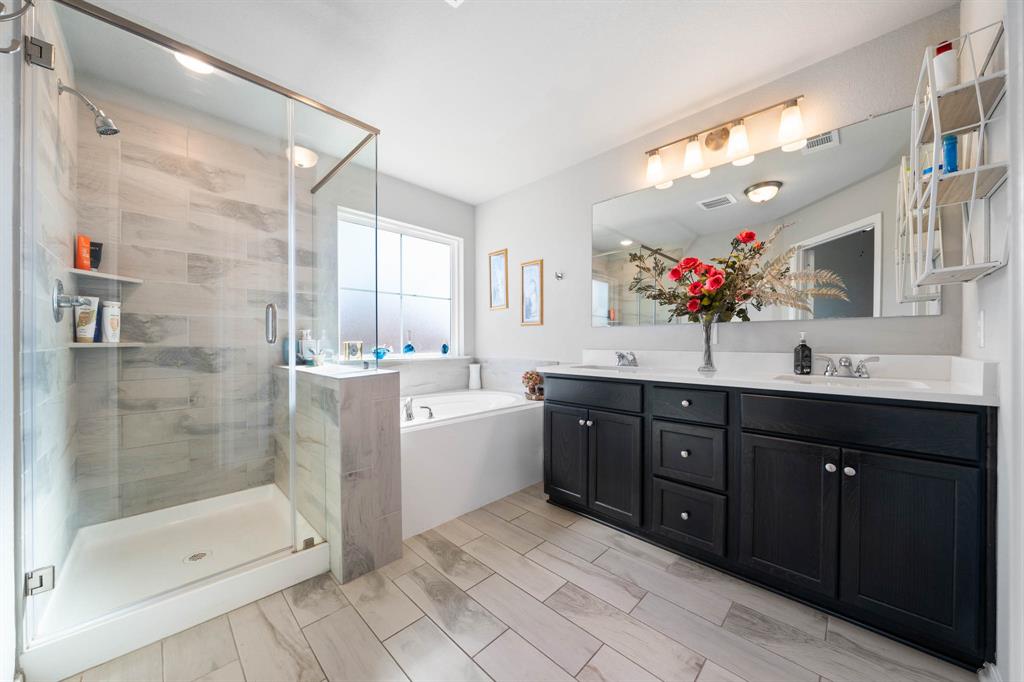 3409 Beutel Road Lorena, TX 76655 - Photo 16 of 32 a spacious bathroom with a sink mirror and shower