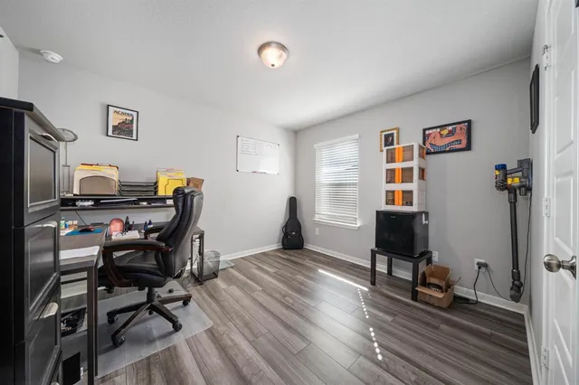 a workspace with furniture and wooden floor