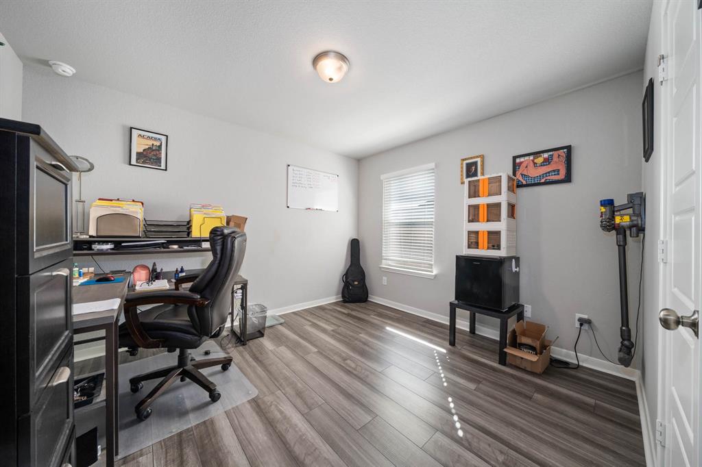 3409 Beutel Road Lorena, TX 76655 - Photo 19 of 32 a workspace with furniture and wooden floor