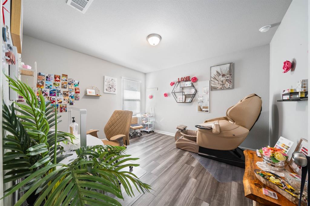 3409 Beutel Road Lorena, TX 76655 - Photo 21 of 32 a living room with furniture rug toys and wooden floor