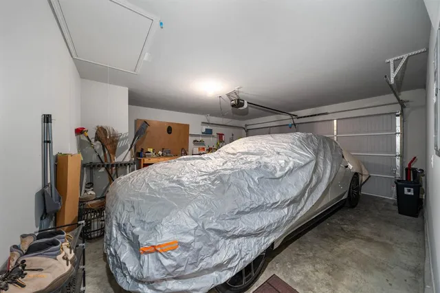 a bed sitting in a room next to a window