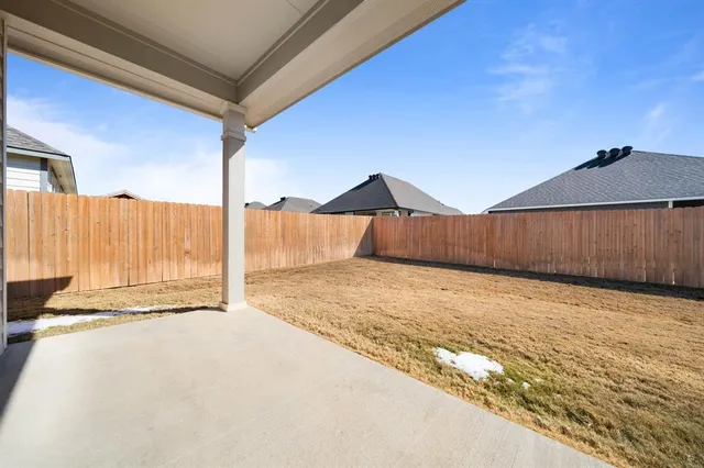 a view of a backyard of a house