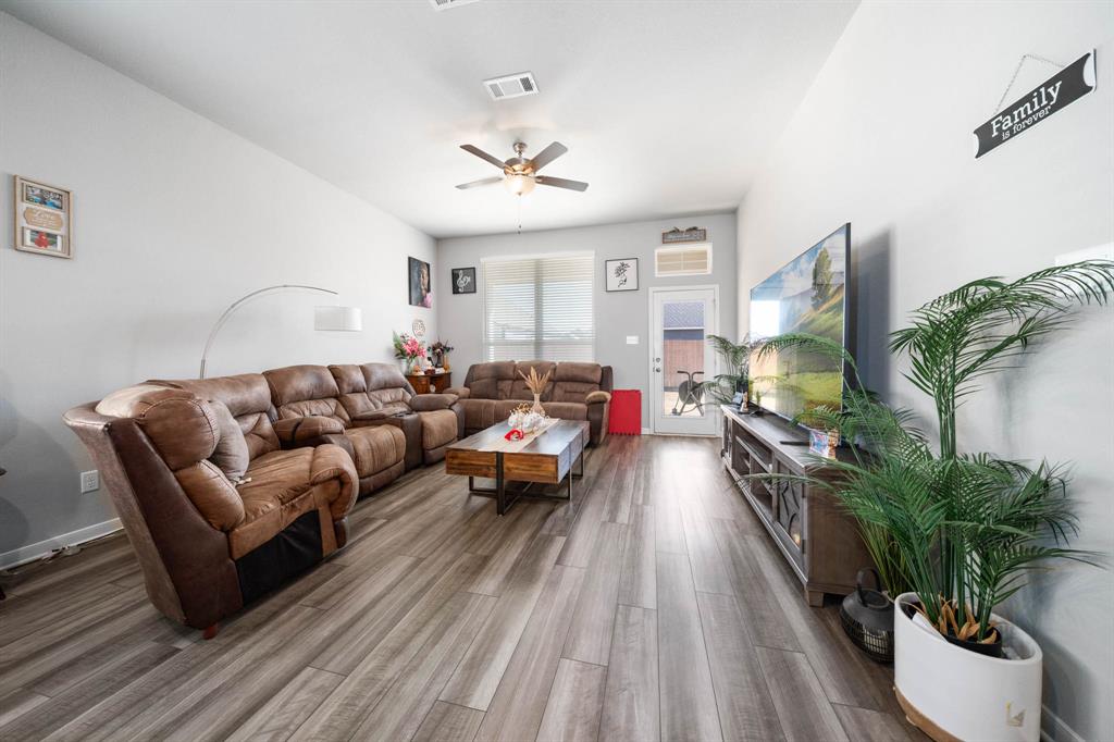 3409 Beutel Road Lorena, TX 76655 - Photo 10 of 32 a living room with furniture and a flat screen tv