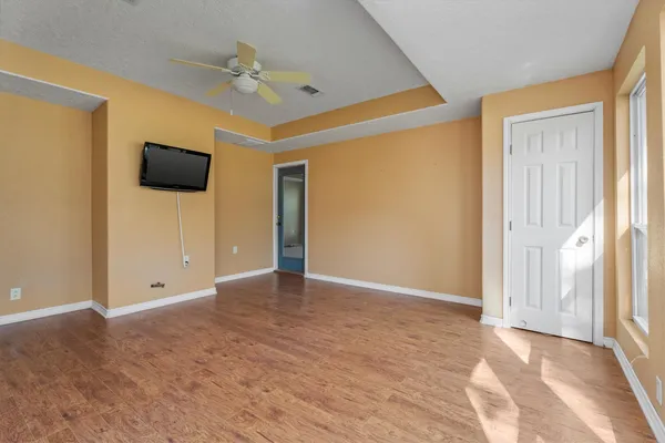 a view of an empty room with a window