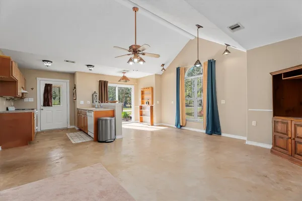 a view of a kitchen with furniture and a window