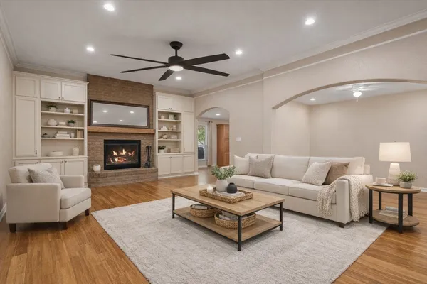 a living room with furniture and a fireplace
