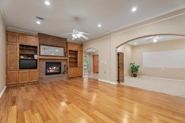 a view of an empty room with a fireplace