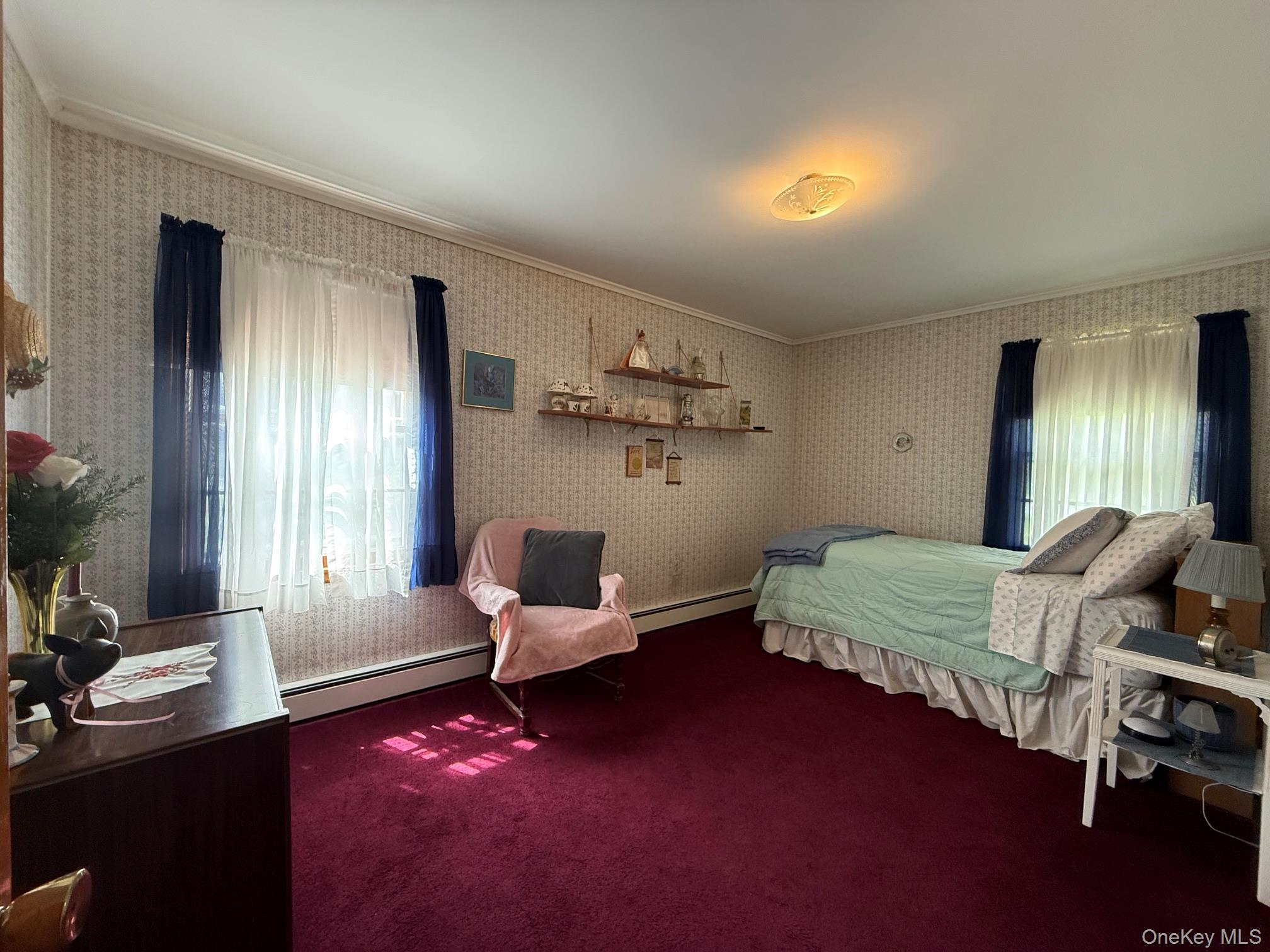 126 Perrys Corners Road Amenia, NY 12501 - Photo 11 of 16 a bedroom with a bed wooden floor and lamp
