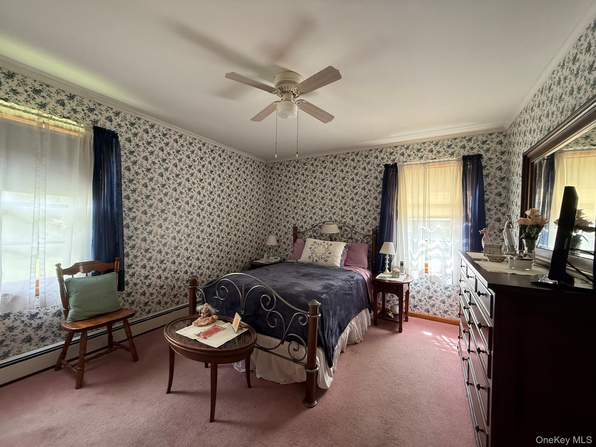 126 Perrys Corners Road Amenia, NY 12501 - Photo 12 of 16 a bedroom with a bed and a dresser in it