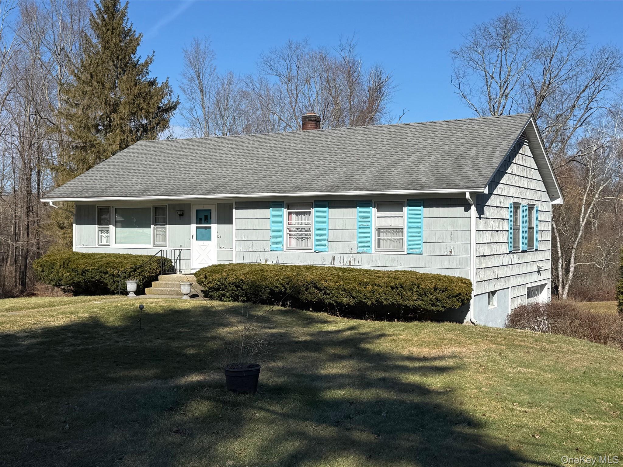 126 Perrys Corners Road Amenia, NY 12501 - Photo 3 of 16 a front view of a house with a yard