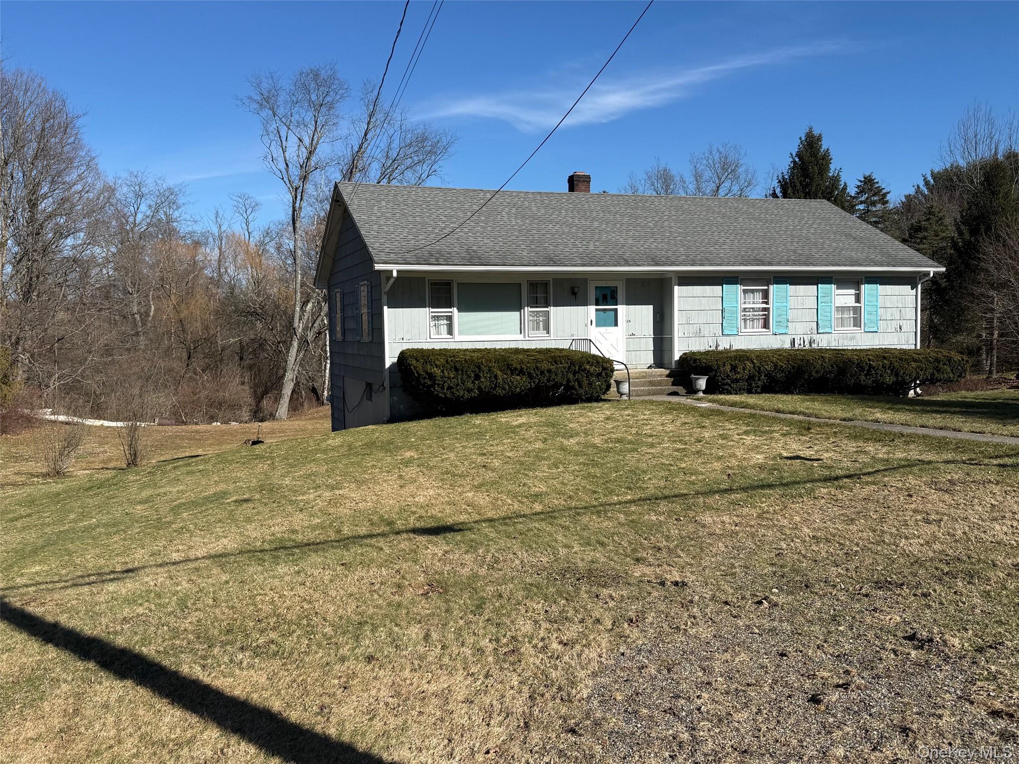 126 Perrys Corners Road Amenia, NY 12501 - Photo 4 of 16 a front view of a house with a yard
