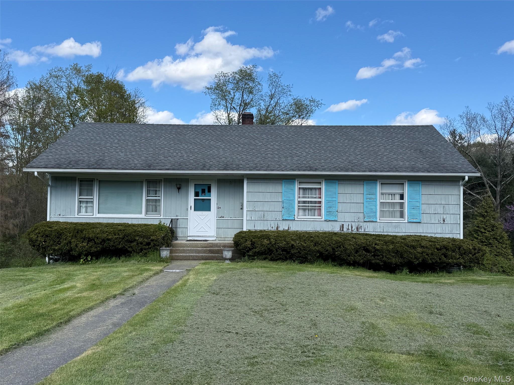 126 Perrys Corners Road Amenia, NY 12501 - Photo 5 of 16 a front view of a house with a garden