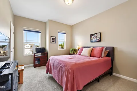 a bedroom with a bed and a cabinets