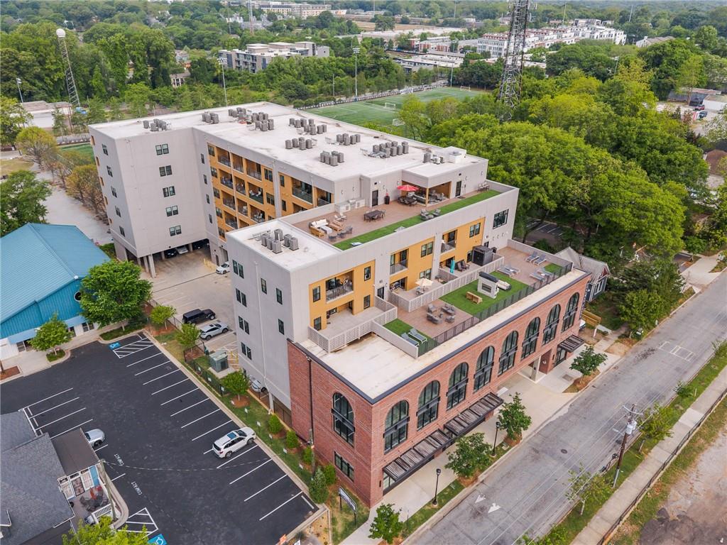 112 Rogers Street Northeast, Unit 304 Atlanta, GA 30317 - Photo 1 of 22 a view of a buildings in front of yard