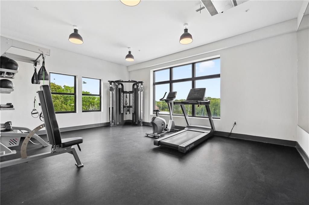 112 Rogers Street Northeast, Unit 304 Atlanta, GA 30317 - Photo 14 of 22 a view of a room with gym equipment