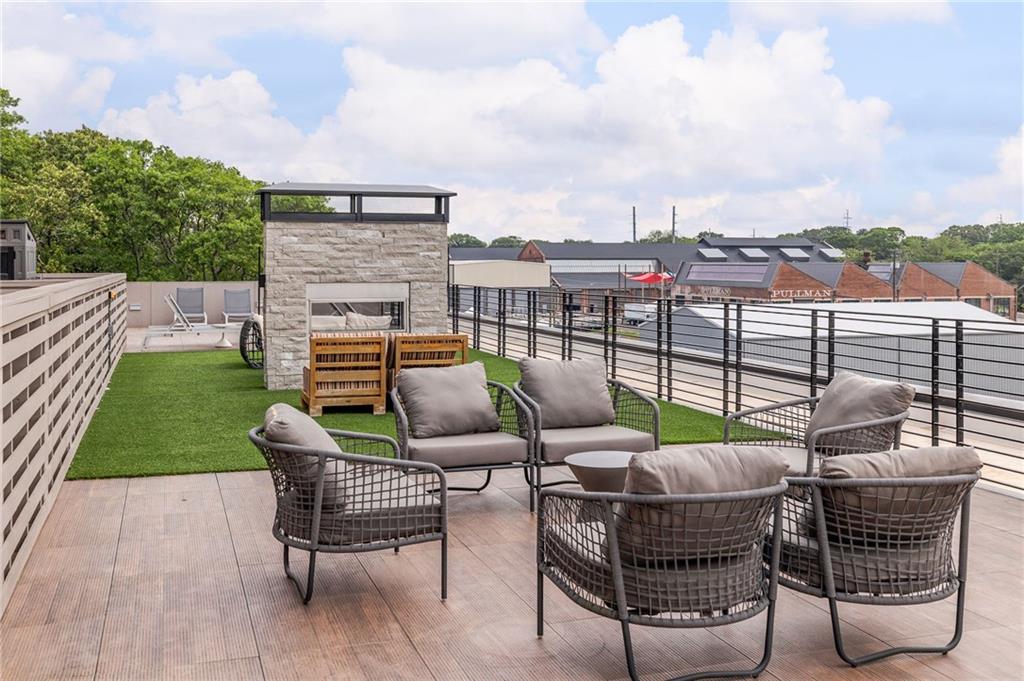 112 Rogers Street Northeast, Unit 304 Atlanta, GA 30317 - Photo 17 of 22 an outdoor sitting area with furniture and garden