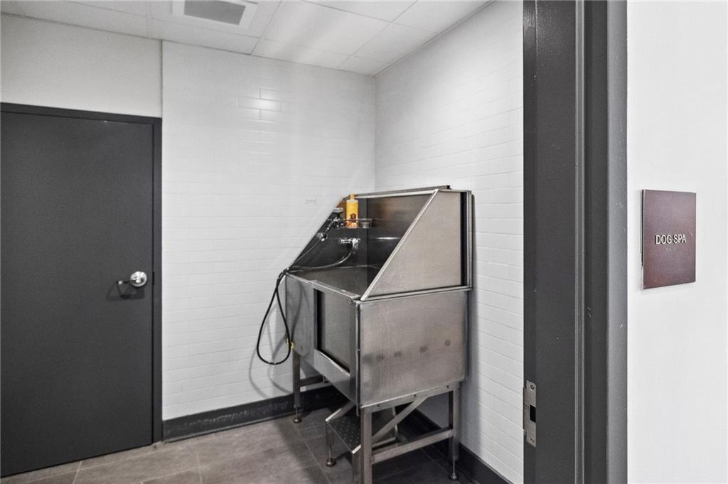 112 Rogers Street Northeast, Unit 304 Atlanta, GA 30317 - Photo 18 of 22 a utility room with dryer and washer