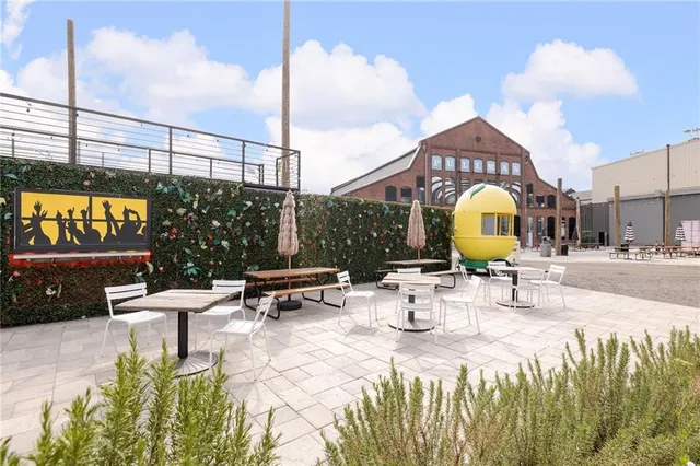 a view of a swimming pool with a table and chairs