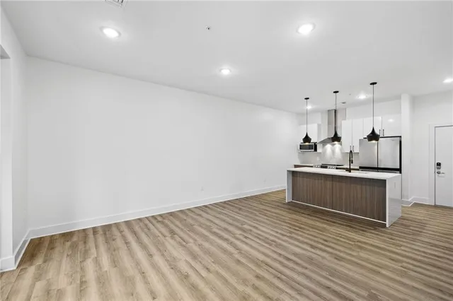 a view of kitchen with wooden floor