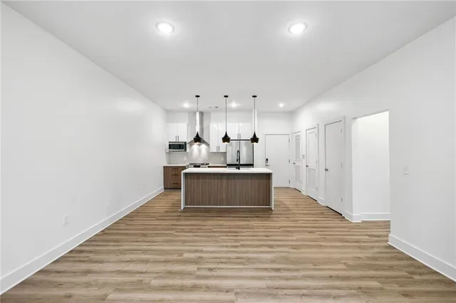 a view of kitchen with wooden floor