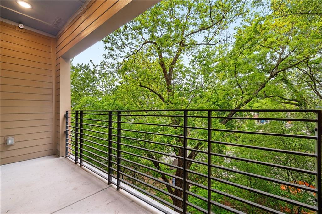 112 Rogers Street Northeast, Unit 304 Atlanta, GA 30317 - Photo 9 of 22 a view of a wooden fence